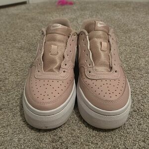 Nike Air Force 1 platforms. Light pink with white platform.